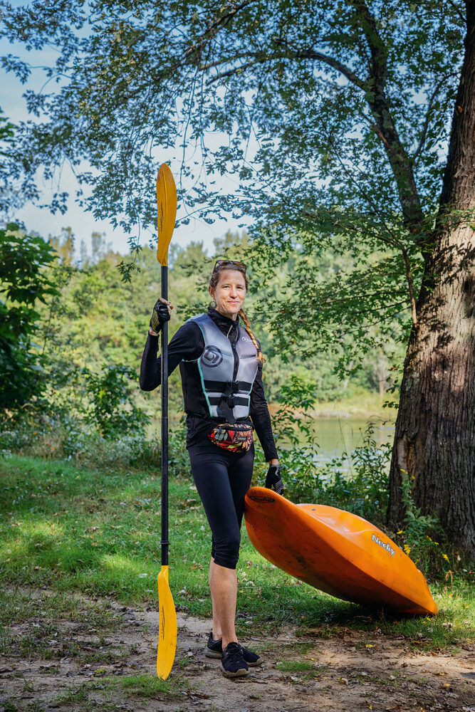 Emily Vogler geared up and ready to paddle the Blackstone in her kayak.